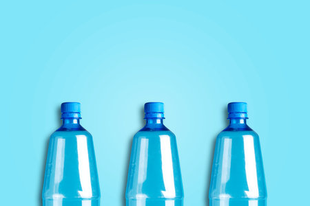 Plastic bottles on a blue background. Copy space. Products, packaging, storage recycle