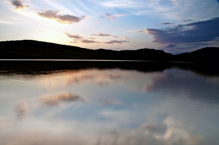 Clouds over the lake with cloud reflectionの写真素材
