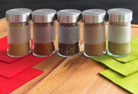 Jar of spices on wood breadboardの写真素材