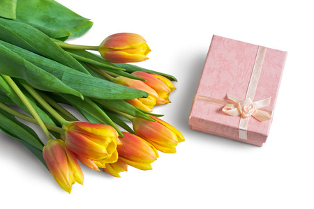 Bouquet of tulips and pink gift box on white background. Selective Focus.の写真素材