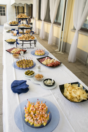 table set with various appetizers, italian foodの写真素材