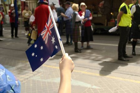 Australia Day in Melbourne - January 26, 2019. Child waving Australian Flagのeditorial素材