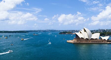 Sydney opera house with ferrys in foreground, view from harbor bridgeのeditorial素材