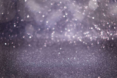 Glitter vintage lights background. lilac, silver, purple. defocused.の写真素材