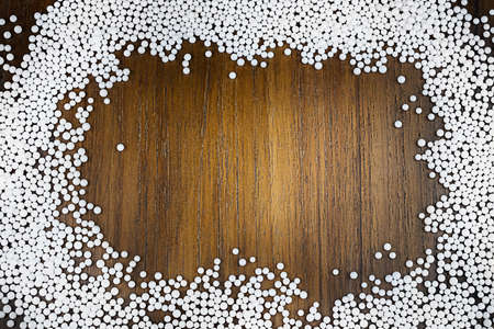 the frame of white balls on old wooden background