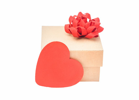 cardboard box gift isolate. gift with red bow and red heart on white backgroundの写真素材