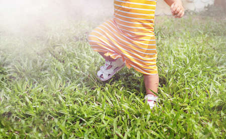 Baby running on the grass