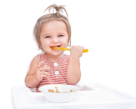 Woman with balloons on yellow background at partyの写真素材