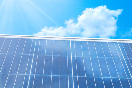 Reflection of clouds and sky in the solar panelの写真素材