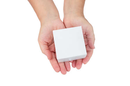 Female hands hold white cardboard box isolated on white backgroundの写真素材