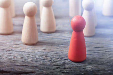 Red female figure leader of the team. Not like everyoneの写真素材