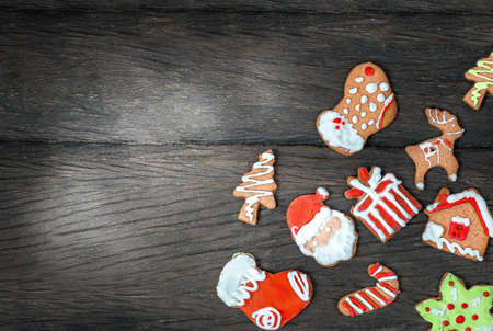 Christmas gingerbread cookies on dark wooden table surfaceの写真素材