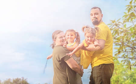 Happy family walking together in the park outdoor