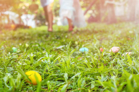 Children run for easter eggs hunting in the backyard outdoor