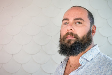 Portrait of a man with a beard on the porch