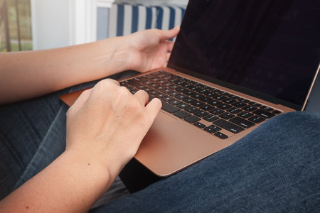 Girl working on laptop screen with copy space