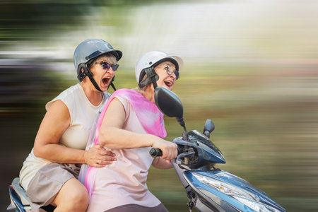 Seniors ride a motorbike with admiration and emotions on vacation
