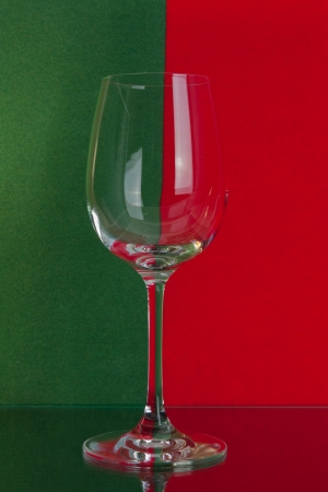The photo shows the glass of wine on the background of two colors.の写真素材