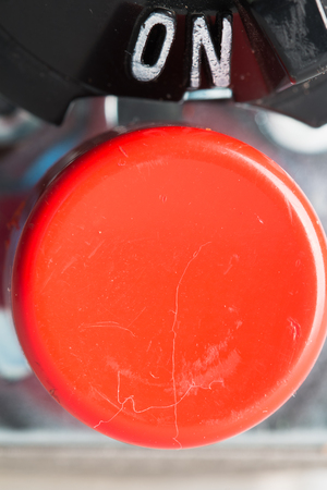 In the photo you see a red button and the inscription on.の写真素材