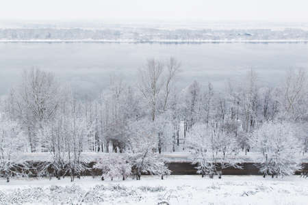 The photo shows the Volga River embankment in winter in the snow in Nizhny Novgorod.