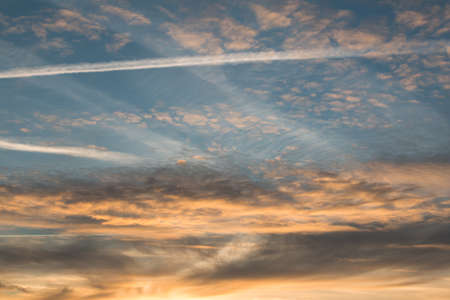 The photo shows a sunset in the park on a winter evening.の写真素材