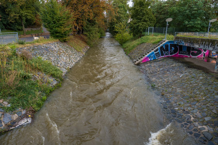 Prague, Czech Republic - September 16, 2024: Rokytka river in the Thomayer Gardens during the floodのeditorial素材
