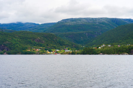 Fjord in Norway: Panoramic view of the shore with housesの写真素材