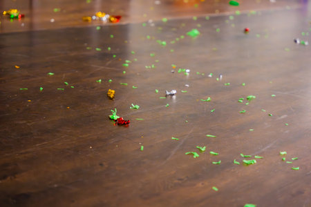 The day after the party. Empty room with confetti and balloons on the floor.の写真素材