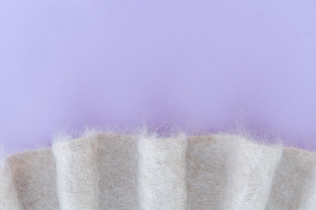 Soft white mohair wool fabric with purple background and pleats
