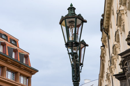 Ornate vintage street lamp with historic architectureの写真素材