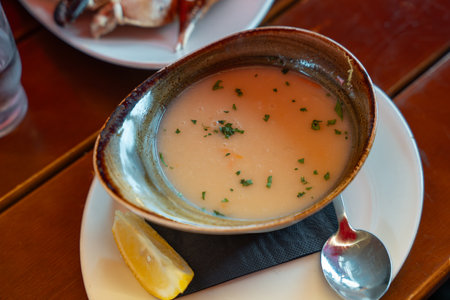 Traditional fish soup with herbs at Bergens national fish market in Norway