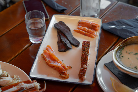 Traditional Norwegian salmon slices and creamy fish soup served at local restaurant.の写真素材