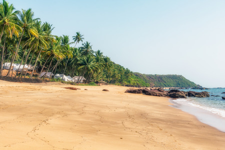Ocean Beach in summer sunlight. Goa, India. Vivid, splittoned image.のeditorial素材