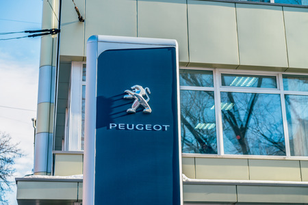 POLTAVA, UKRAINE - Building of Peugeot car shop in Poltava city, Ukraine. Vivid, colorful post processing image.のeditorial素材