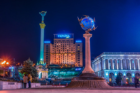 KYIV, UKRAINE - MARCH 23, 2017: Maidan Nezalezhnosti (literally: Independence Square) is the central square of the capital city of Ukraine with people in the night time. Vivid, splittoned image.のeditorial素材