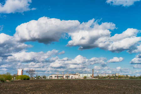 Industrial buildings in the sunny day with cloud and blue skyの写真素材