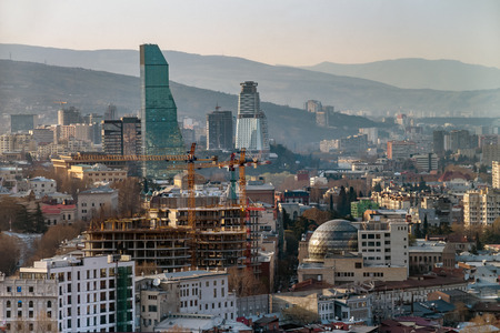 Panorama of Tbilisi, Georgia in sunset rays. Vivid, saturated, splittoned image.の写真素材