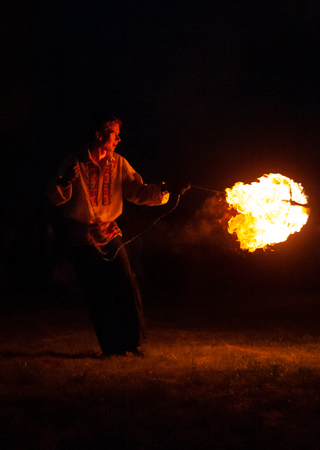 POLTAVA, UKRAINE - JULY 06, 2018: fire show on the open air meeting celebrating old christian...