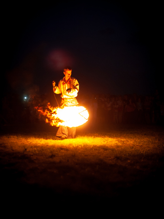 POLTAVA, UKRAINE - JULY 06, 2018: fire show on the open air meeting celebrating old christian traditionのeditorial素材