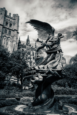NEW YORK, USA - JULY 13, 2016: statue near St.John cathedral "Peace fountain"のeditorial素材