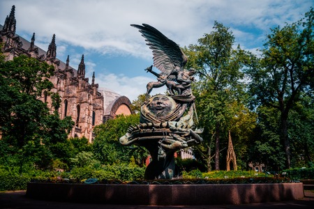 NEW YORK, USA - JULY 13, 2016: statue near St.John cathedral "Peace fountain"のeditorial素材