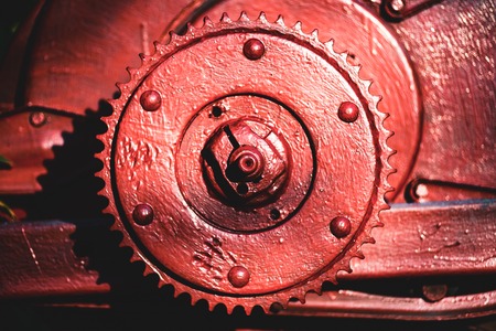 Metal painted part of unidentified old engine in sun lightの写真素材