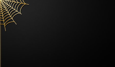 This captivating scene features a delicate golden spider web set against a deep black backdrop, casting an enchanting atmosphere ideal for artistic inspiration or decoration.の写真素材