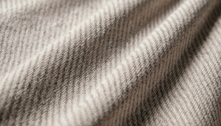 Gentle waves of a soft, warm fabric create a calming pattern as sunlight filters through on a quiet...