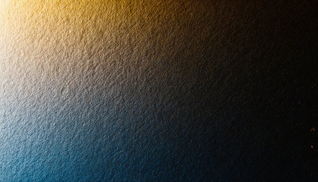 A captivating scene unfolds as warm golden hues softly blend into deep blues, creating a serene and calming atmosphere. This gradient backdrop evokes a sense of peace and tranquility.の写真素材