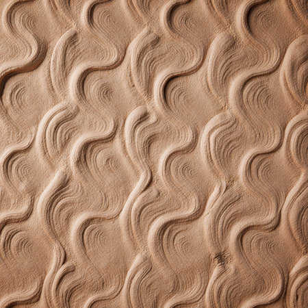Intricate patterns adorn the sandy surface, formed by the gentle caress of wind and water. This natural artwork captivates with its flowing lines and earthy tones, inviting wonder.の写真素材