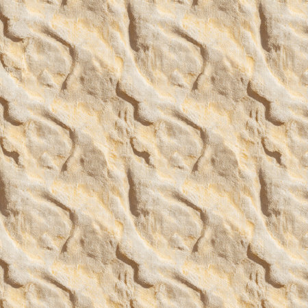 The sand is illuminated by the sun, revealing intricate wave-like patterns that create an inviting and tranquil atmosphere. The smooth texture invites touch and exploration.の写真素材