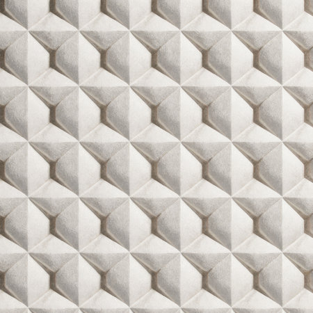 A detailed view of a textured wall featuring an intricate geometric pattern. This architectural design element adds depth and visual appeal to contemporary interiors, perfect for creative settings.の写真素材