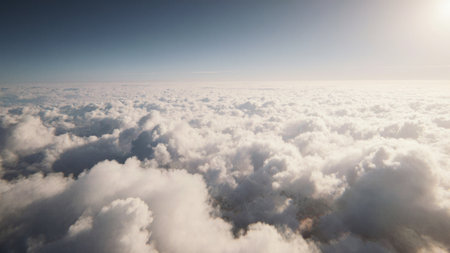 Fluffy white clouds stretch endlessly across a clear blue sky during a sunny afternoon. The sun...