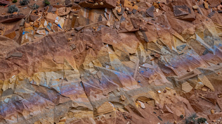 Desert landscape dominated by a variety of colorful rocks and boulders, the rocky terrain is.